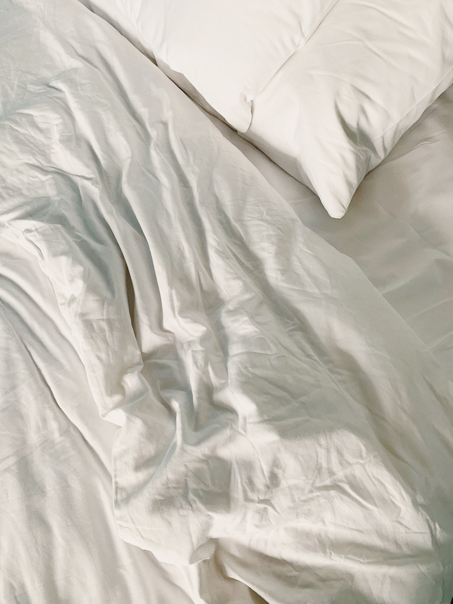 White Pillow and Bed Sheet 